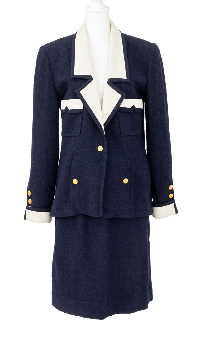 Chanel Boutique Navy Blue Wool Blend Skirt Suit: Chanel Boutique Navy Blue Wool Blend Skirt Suit, the jacket with cream colored silk lining, gold-tone "CC" buttons and two front flap pockets with pencil skirt and silk blue lining, "Chanel Boutique"
