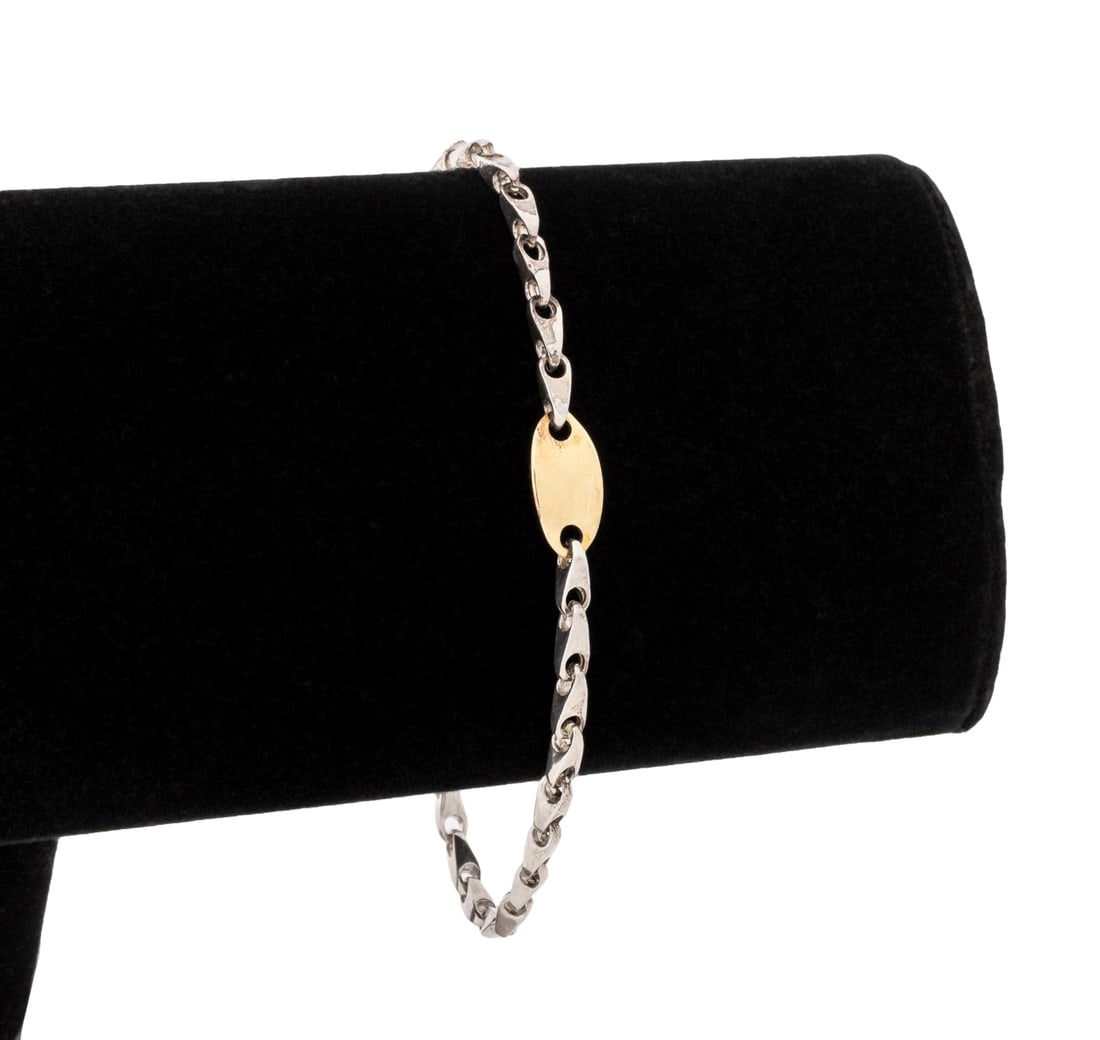 Sterling Silver and Yellow Gold ID Bracelet: Sterling Silver and 14K Yellow Gold Identification Bracelet, designed as solid sterling silver links with centered solid 14K yellow gold identification link, brightly polished, joined with lobster