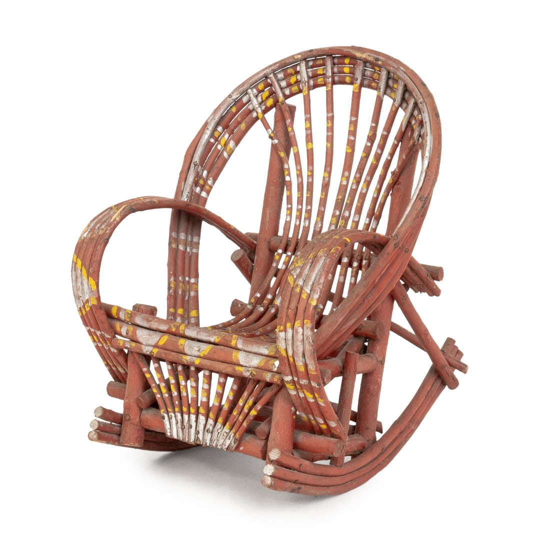 American Painted Twig Child's Rocking Chair: American Paint-Decorated Twig Child's Rocking Chair, with red and yellow geometric decoration. 21.75" H x 15.5" W x 20" D; seat: 9" H. Provenance: From a 21 East 87th Street Estate. Keywords: