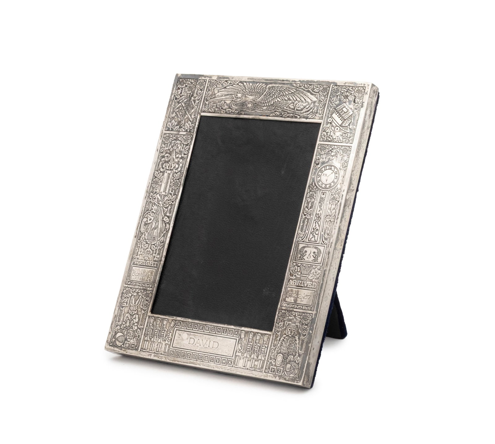 Cartier Sterling Baby Announcement Picture Frame: Cartier Sterling Silver Baby Announcement Picture Frame, engraved "David" and marked "Cartier / Sterling" to the bottom edge. Weight: 2.92 ozt.; photo image: 4" H x 2.25" W; frame: 6" H x 4.5" W x