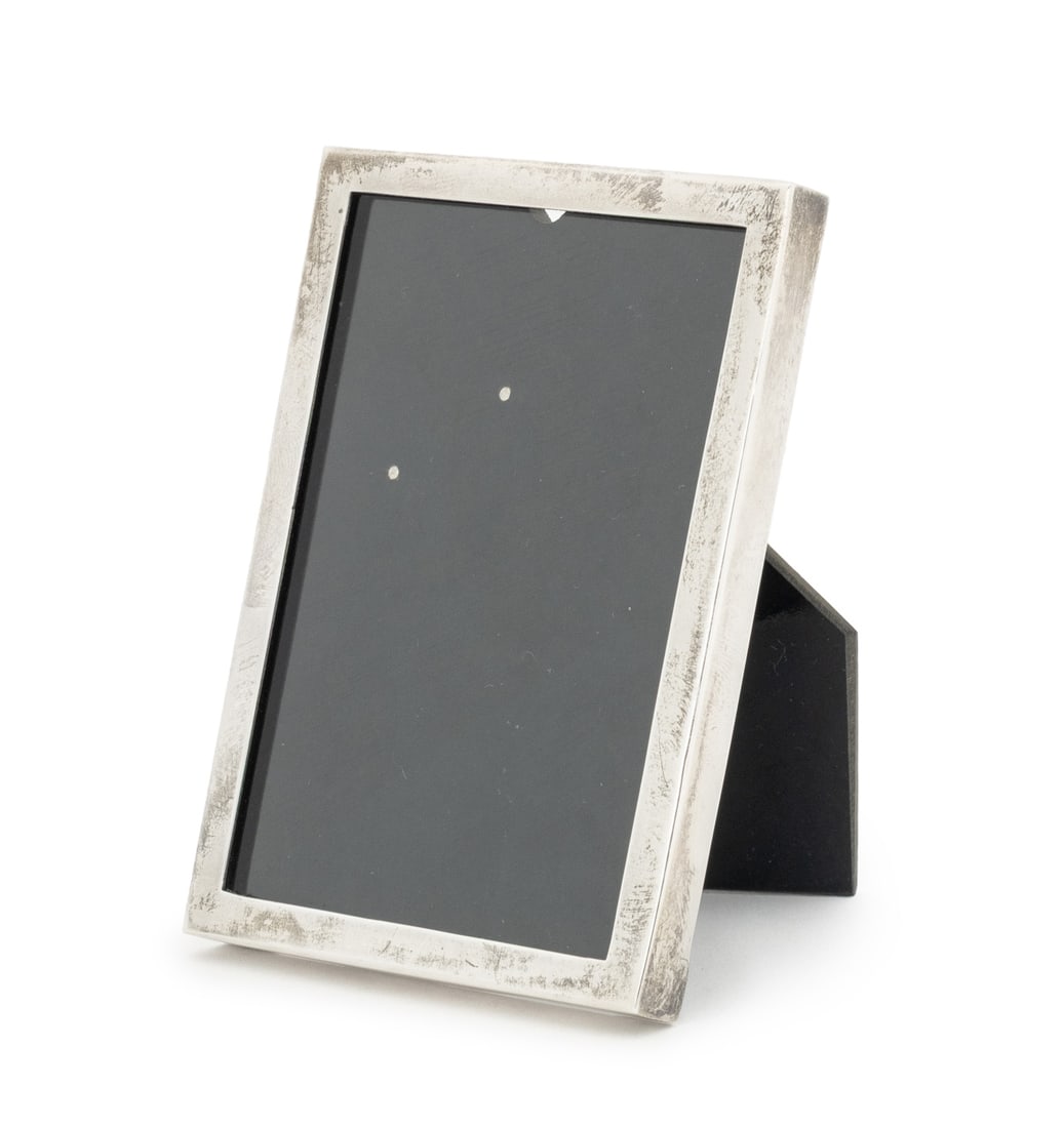 Tiffany & Co. Makers Sterling Silver Picture Frame: Tiffany and Company Makers Sterling Silver Picture Frame, marked "Tiffany & Co. Makers / Sterling / 23460" underside, in tiffany blue bag. Weight: 0.6 ozt; 3.5" H x 2.5" W x 0.5" D; open: 2.25" D. Pro