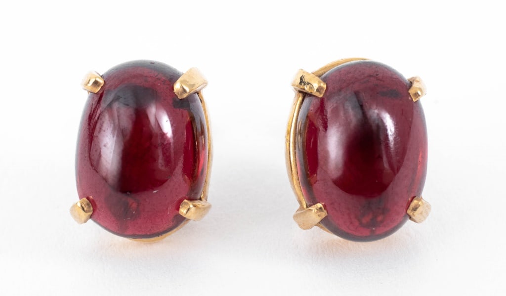 Modern Red Glass Cabochon and Yellow Gold Earrings: Pair of Modern Red Glass Cabochon and 14K Yellow Gold Earrings, featuring two prong set oval cabochons approx. 11 x 8 mm, worn through pierced earlobes with posts and friction backs, marked: "14K". Me