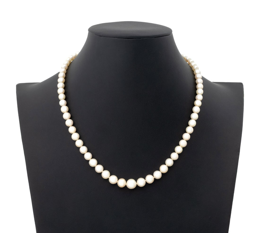 Modern Cultured Pearl Necklace: Modern Cultured Pearl Necklace, featuring fully drilled round cultured pearls approx. 5.5 9.0 mm, strung on silk cord, knotted between each pearl, joined with base metal magnetic ball clasp.