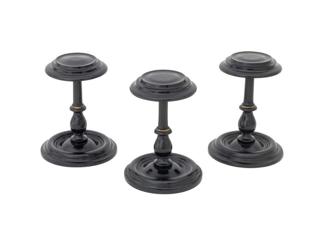 Ebonized and Turned Wood Pedestal Hat Stands, 3: Group of Three Ebonized and Turned Wood Pedestal Hat Stands. 7.5" H x 6" Diameter. Provenance: From a 21 East 87th Street Estate. Keywords: Milliner stand, Candle stand, Tabletop decor, Interior desig