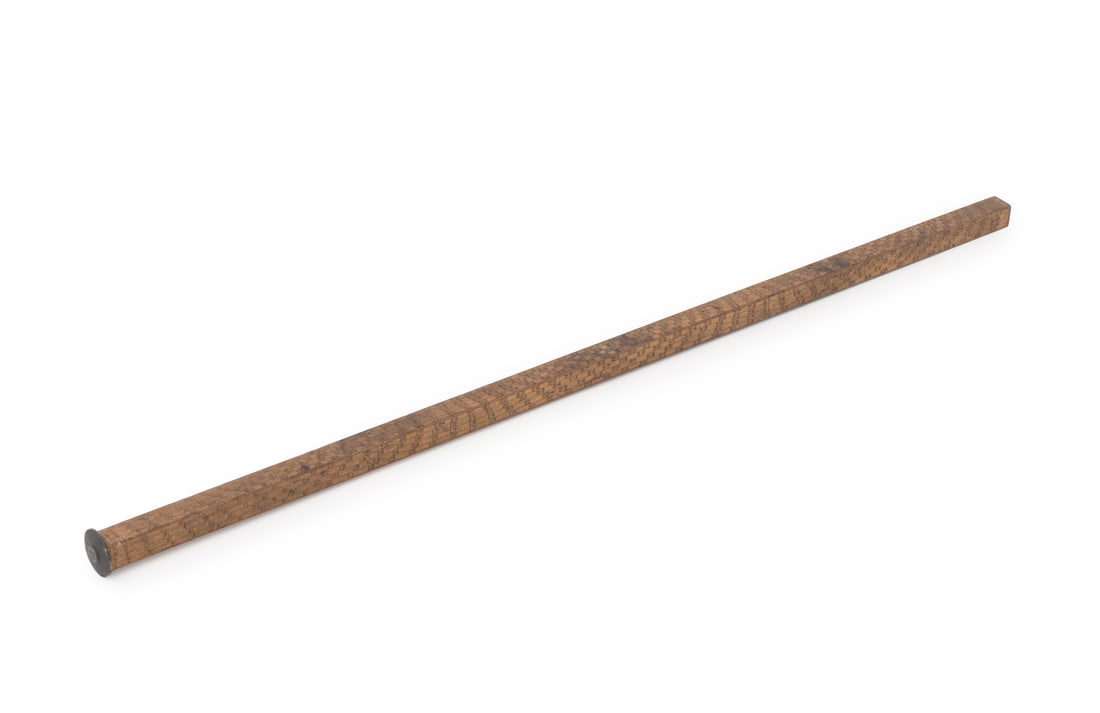 Universal Carved Wood Ruler, Early 20th C.: Universal Carved Wood Ruler, early 20th century, with round metal end cap and carved measurements. 36" L x 1.5" Diameter. Provenance: From a 21 East 87th Street Estate. Keywords: Antique Tools,