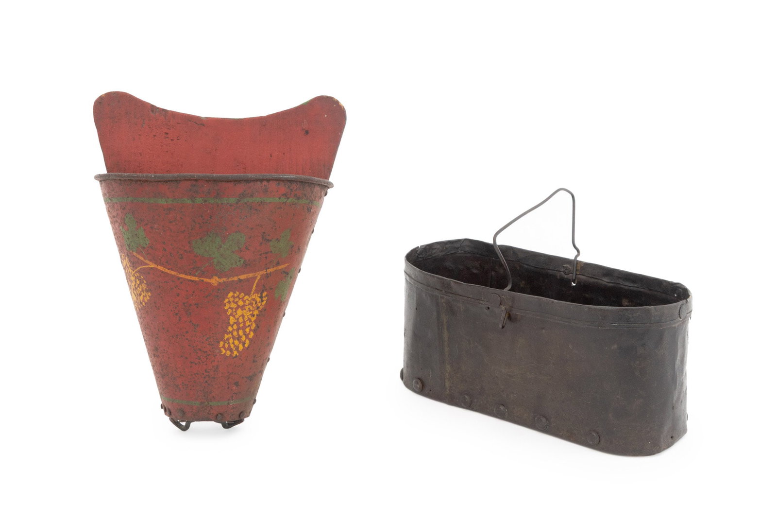 American Folk Art Toleware Vessels, 2: Two American Folk Art Toleware Vessels, comprising: one oval sheet metal box with swing handle and wood base and one red and green tole hanging basket with wood backing board. Taller: 10.5" H x 7.75" 