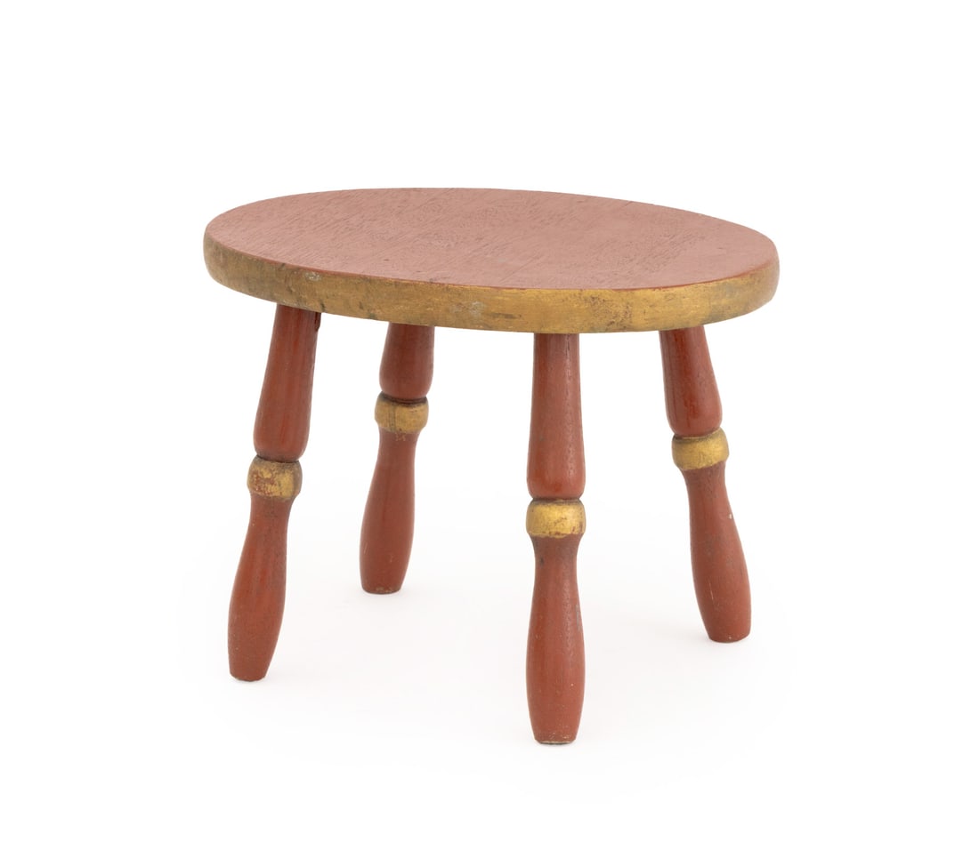 American Red Painted and Giltwood Footstool: American Red Painted and Giltwood Footstool, with oval top above four turned wood legs. 9.5" H x 13" W x 9.5" D. Provenance: From a 21 East 87th Street Estate. Keywords: Americana, American