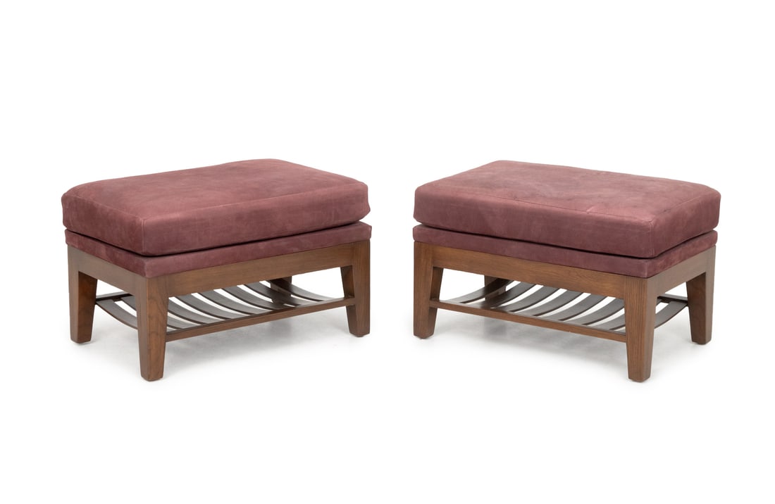 Burgundy Suede Upholstered Ottomans, Pair: Pair of Burgundy Suede Upholstered Ottomans, each with four legs supported by an undertier. 13" H x 28" W x 17" D. Provenance: From a New York City Collection. Keywords: Modern Furniture, Stools,