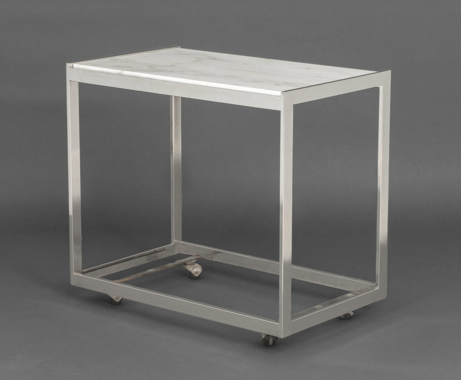 Modern Carrara Marble Top Chrome Side Table: Modern Carrara White Marble Top Chrome Side Table, on casters. 28" H x 30.5" W x 19.25" D. Provenance: From a Westchester County Estate. Keywords: Modern Furniture, Vintage Furniture, Occasional