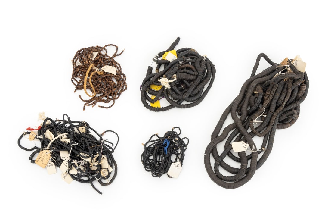 Collection of Coconut Shell Beads: Collection of Coconut Shell Beads, including heishi beads, cylindrical beads, and some with brass beads. Largest bead: 0.75" Diameter. Provenance: From the Estate of Jewelry Designer Irena Corwin.