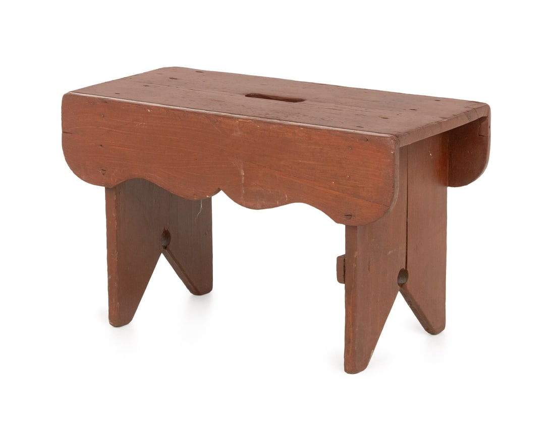 American Red Painted Wood Milking Stool: American Red Painted Wood Milking Stool, with carved apron and single central hole to seat. 12.75" H x 20" W x 10.5" D. Provenance: From a 21 East 87th Street Estate. Keywords: Americana, Antique