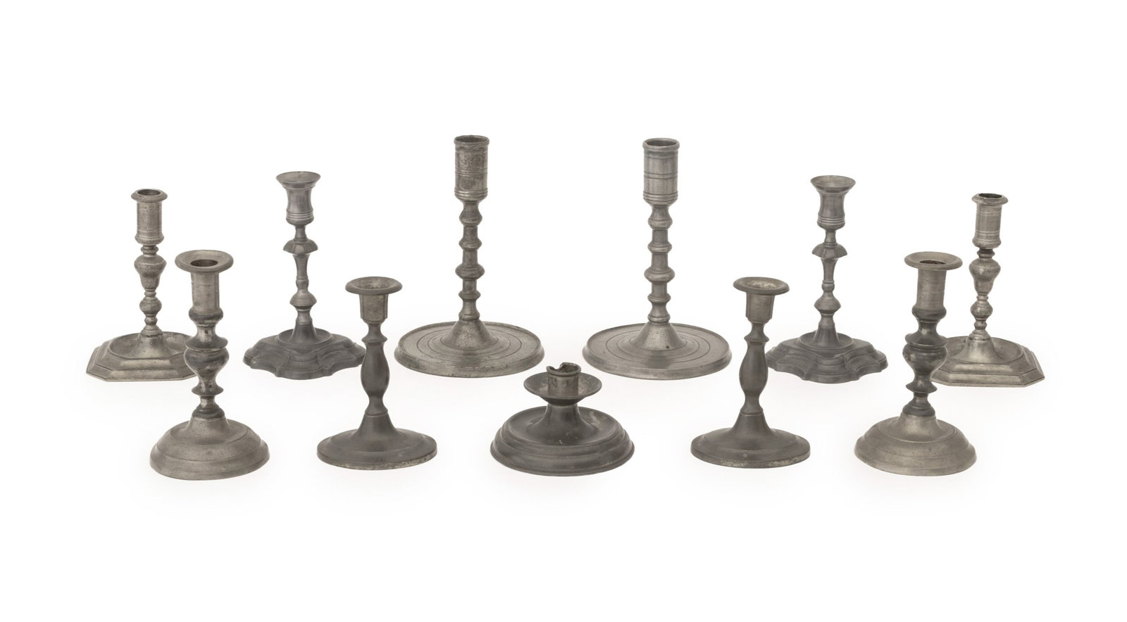 Collection of Antique Pewter Candlesticks, 11: Collection of Eleven Antique Pewter Candlesticks, five pairs and one chamberstick. Tallest: 8.75" H x 5.5" Diameter. Provenance: From a 21 East 87th Street Estate. Keywords: Baroque Style, English,