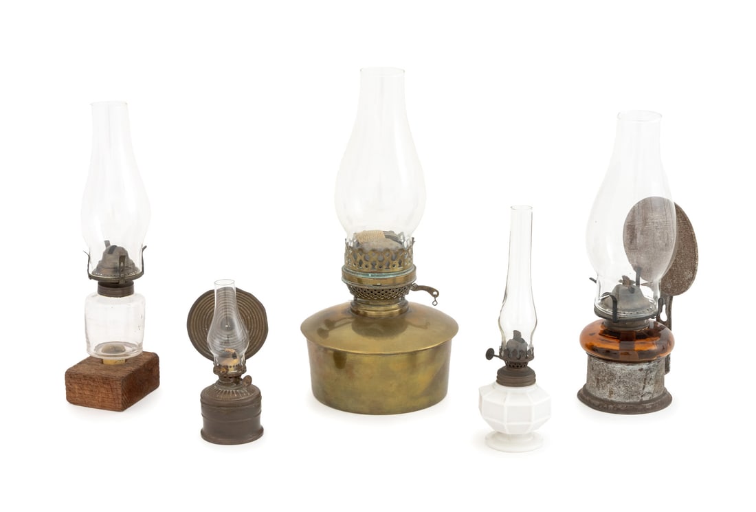 Collection of Antique & Vintage Oil Lamps, 5: Collection of Vintage and Antique Oil Lamps, one with amber glass base, one with white milk glass, one brass, and two with reflector backplates. Tallest: 13.25" H x 6.25" Diameter. Provenance: From a