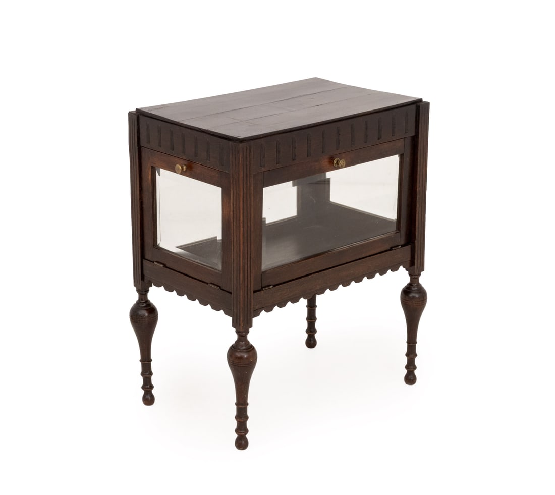 Aesthetic Movement Carved Wood Vitrine Cabinet: Aesthetic Movement Carved Wood Vitrine Cabinet, with two beveled glass doors to front and side above turned wood legs. 28.5" H x 23.5" W x 15.5" D. Provenance: From a Long Island, New York Estate. Key