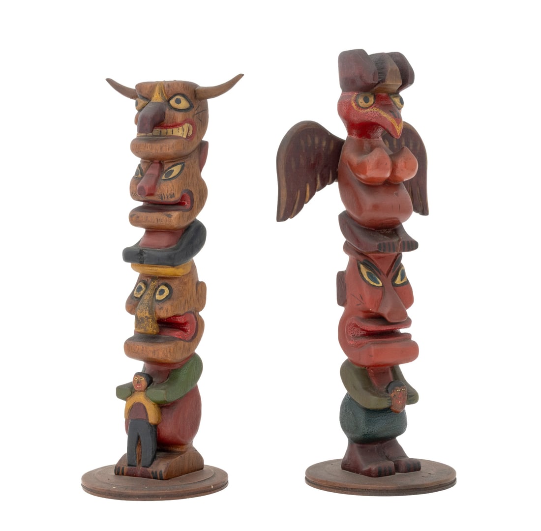Alaskan Folk Art Model Totem Poles, 2: Group of Two Alaskan Folk Art Model Totem Poles, carved and painted wood, each marked "Alaska" , one also marked "79th C.B" to circular base. Taller: 12.5" H x 4.5" Diameter. Provenance: From a New