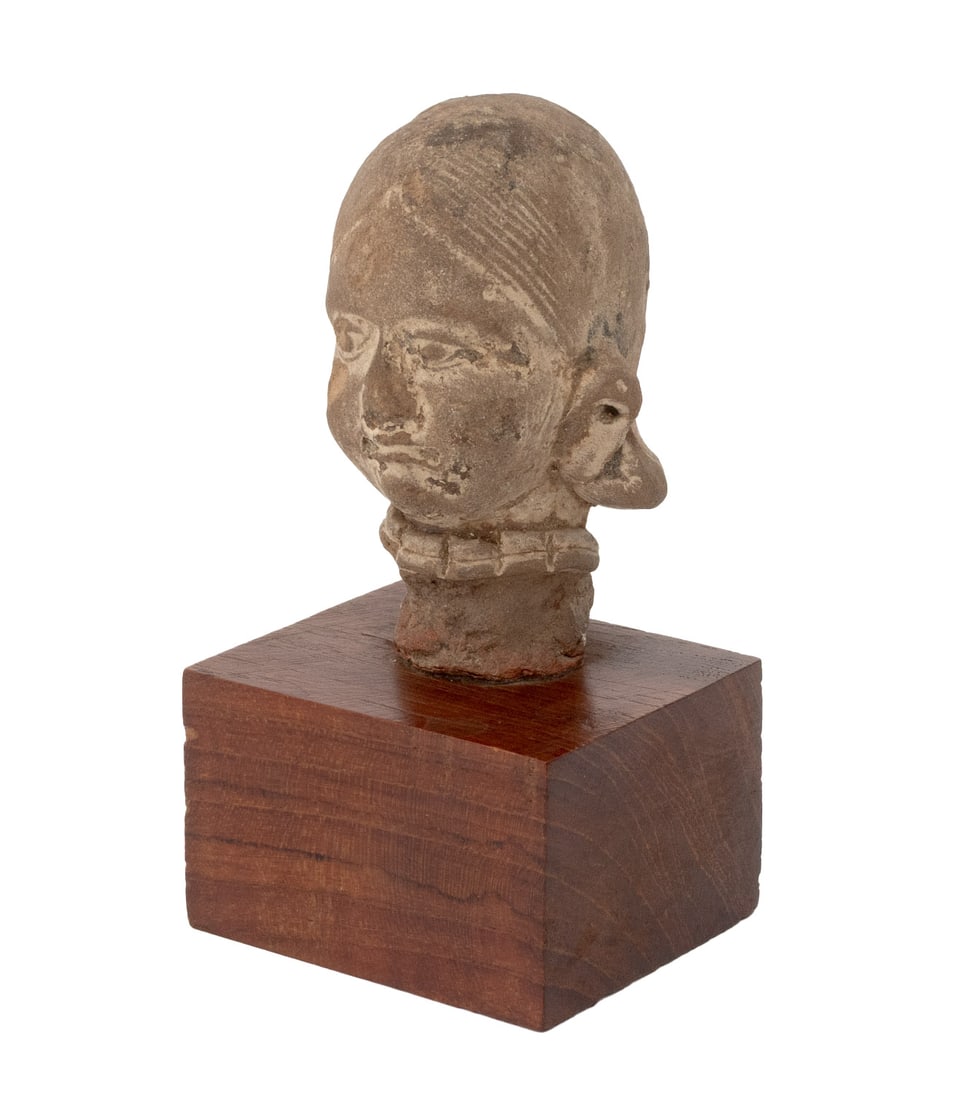 Indian Bust of a Woman Terracotta Sculpture: Indian Bust of a Woman Terracotta Sculpture, probably Gupta Period, mounted on a wood plinth. Overall: 4.75" H x 2.5" W x 2" D. Provenance: From a 21 East 87th Street Estate. Keywords: South Asian