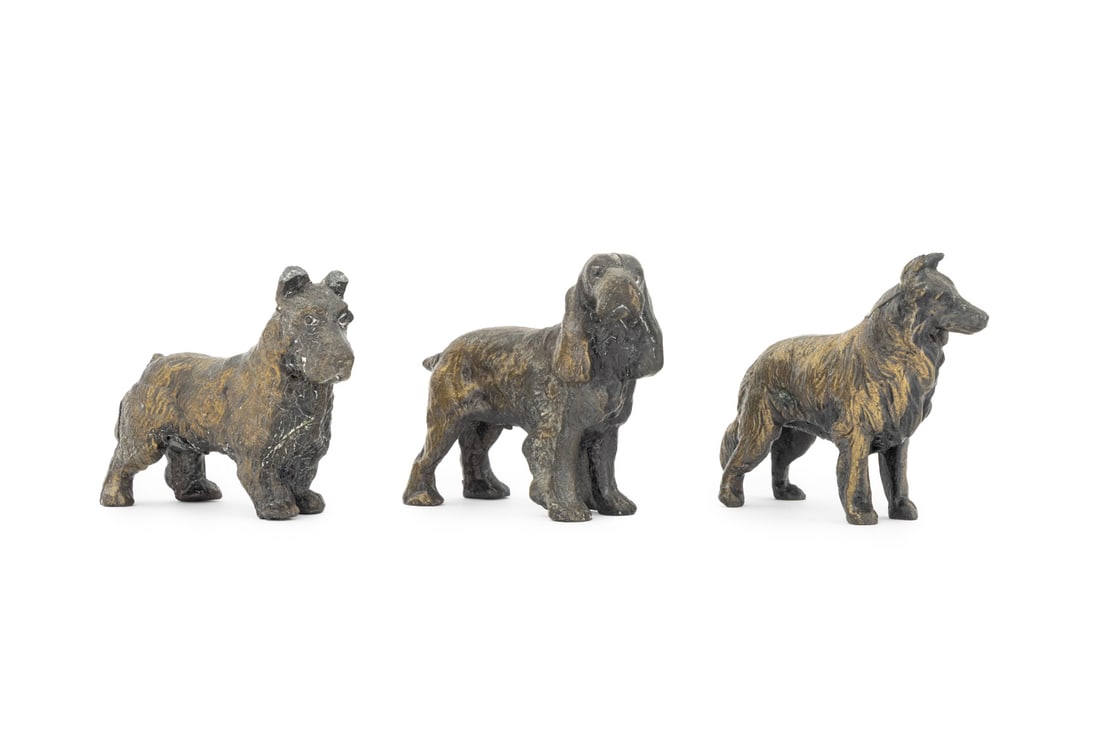 Vintage Cast Metal Dog Sculptures, 3: Three Vintage Cast Metal Dog Sculptures, early 20th Century, comprising: English Cocker Spaniel, Scottish Terrier, and Collie. Largest: 2.25" H x 3" W x 1" D. Provenance: From a Central Park West