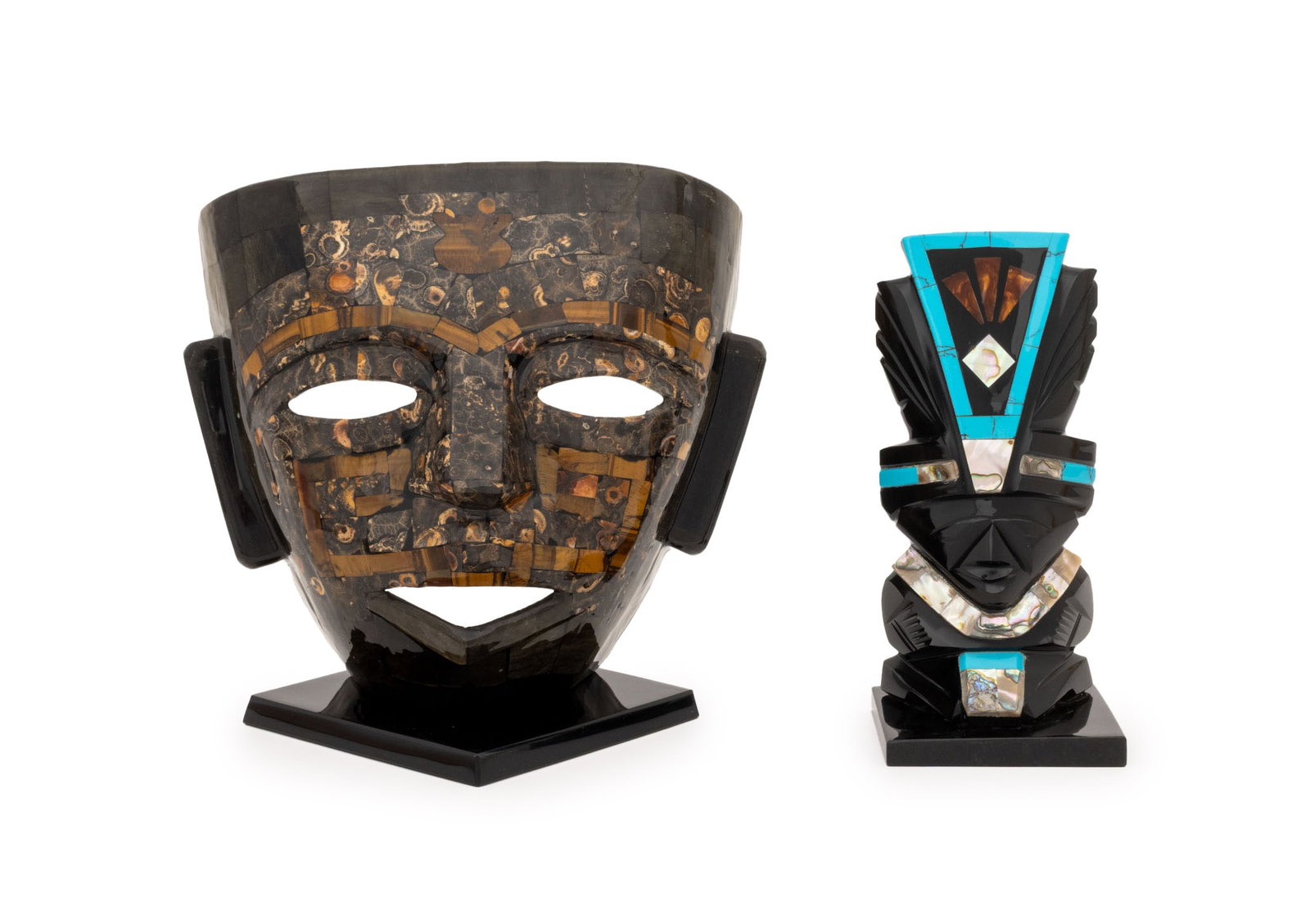 Mexican Carved Stone Sculptures, 2: Two Mexican Carved Stone Sculptures, one a black obsidian figure with mother-of-pearl and turquoise details, and one a mosaic masque with tiger's eye and jasper. Larger: 7.5" H x 8" W x 6.25" D.