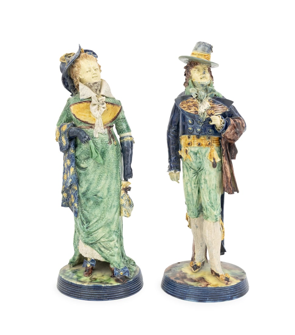 French Glazed Majolica Figurines, 19th C., Pair: Pair of French Polychrome Glazed Majolica Figurines, 19th century, the man and woman in formal 19th century dress mounted on circular bases, unmarked. Taller: 11.25" H x 4.25" Diameter. Provenance: