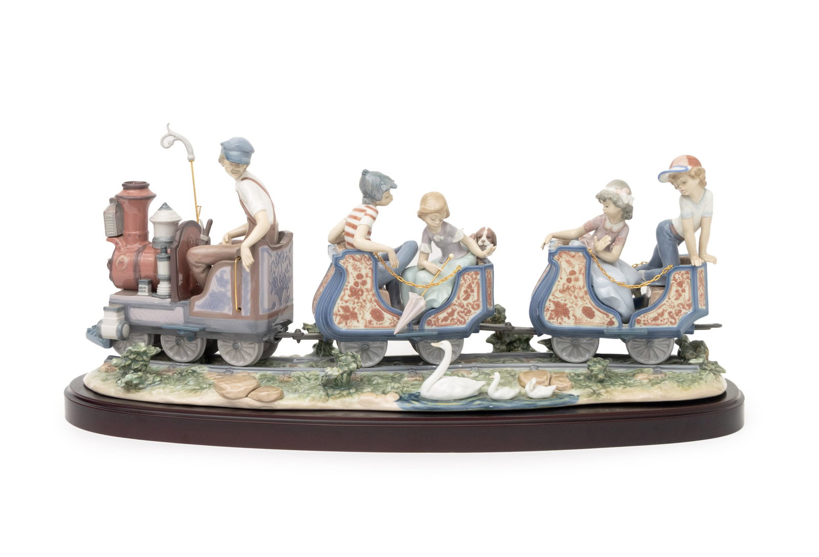 Lladro "Circus Train at the Fair" Figurine: Lladro "Circus Train at the Fair" Porcelain Figurine, marked and numbered "1517" to underside, mounted on wood base. Overall: 11" H x 25.5" W x 9.5" D. Provenance: From a Fifth Avenue Collection.