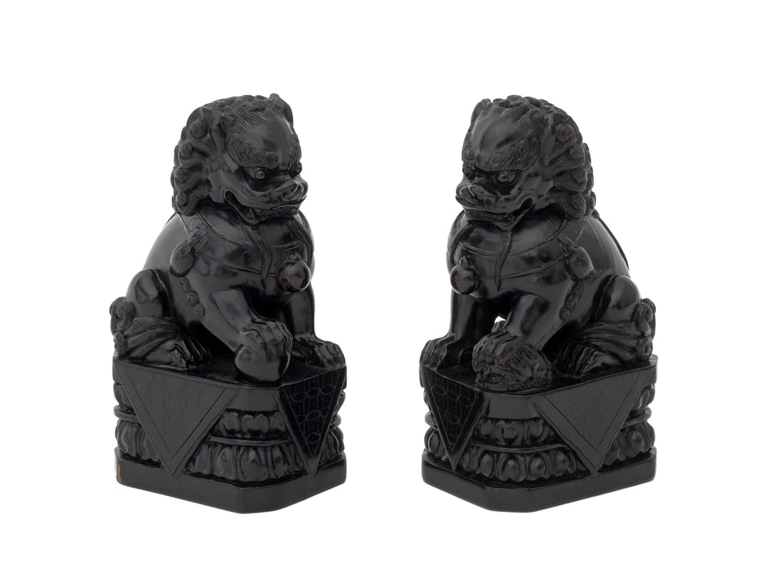 Chinese Carved Wood Foo Lion Sculptures, Pair: Chinese Carved and Ebonized Wood Foo Dog Sculptures, one holding ball the other a cub, each with character mark underside. 5" H x 2.75" W x 2.25" D. Provenance: From a New York City Collection. Keywor