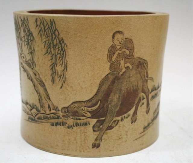 Chinese Carved Yixing Brushpot w/ Figure & Ox: A Yixing brushpot with carved and painted scene of figure on ox and calligraphy, China; marked. Dimensions: 5" H x 6-1/4" diameter