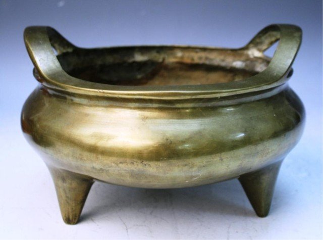 Chinese Bronze Incense Burner: Round bronze tripod incense burner, China; marked. Dimensions: 6-1/4"H x 10" diameter