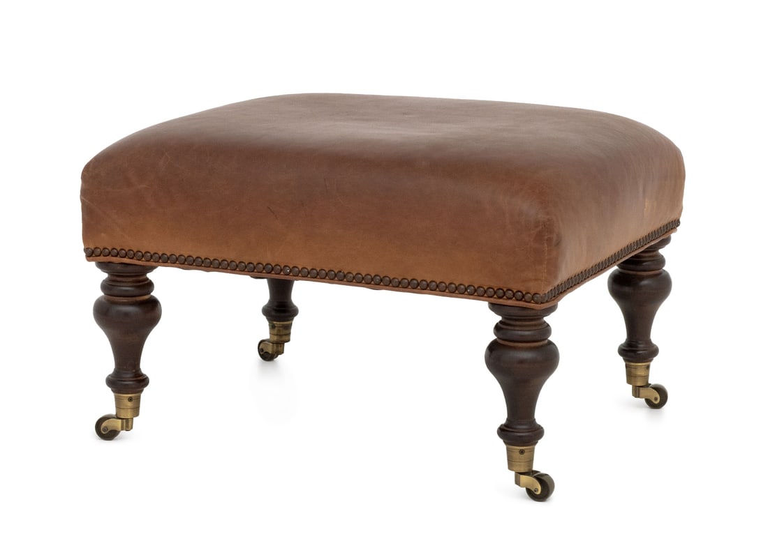 George Smith Attr. Leather Upholstered Ottoman: George Smith Attributed Modern Leather Upholstered Ottoman, ebonized turned wood legs on casters, brass nail trim, Lee Industries label underside. 16" H x 23.5" W x 19.5" D. Provenance: From a Forest 
