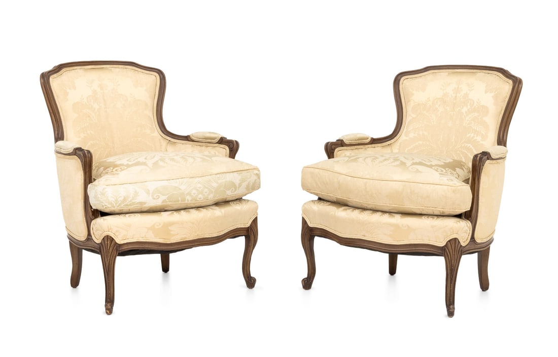 Louis XV Style Carved Wood Bergeres, Pair: Pair of Louis XV Style Carved Wood Bergeres, white silk damask upholstery. 34" H x 29" W x 26" D; seat: 20" H. Provenance: From a Forest Hills Gardens Estate. Keywords: Classical Design, French Furnit