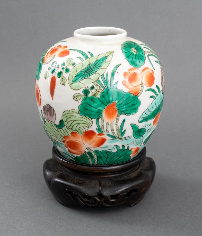 Chinese Famille Verte Porcelain Vase: Chinese Famille Verte Porcelain Vase, globular form hand-painted with lotus flower motif, together with carved wood stand. Vase: 5.25" H x 4.5" Diameter. Provenance: From the Upper East Side Apartment