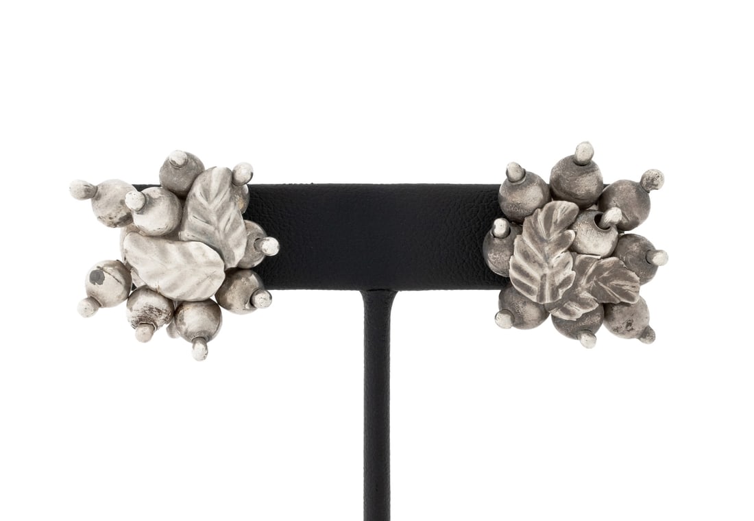 William Spratling Sterling Grape Cluster Earrings: Pair of William Spratling Sterling Silver Grape Cluster Form Earrings, brightly polished, worn on earlobes with clip on screw backs, marked: "SPRATLING SILVER". Measuring approx. 1 1/8" x 1", 0.56 ozt