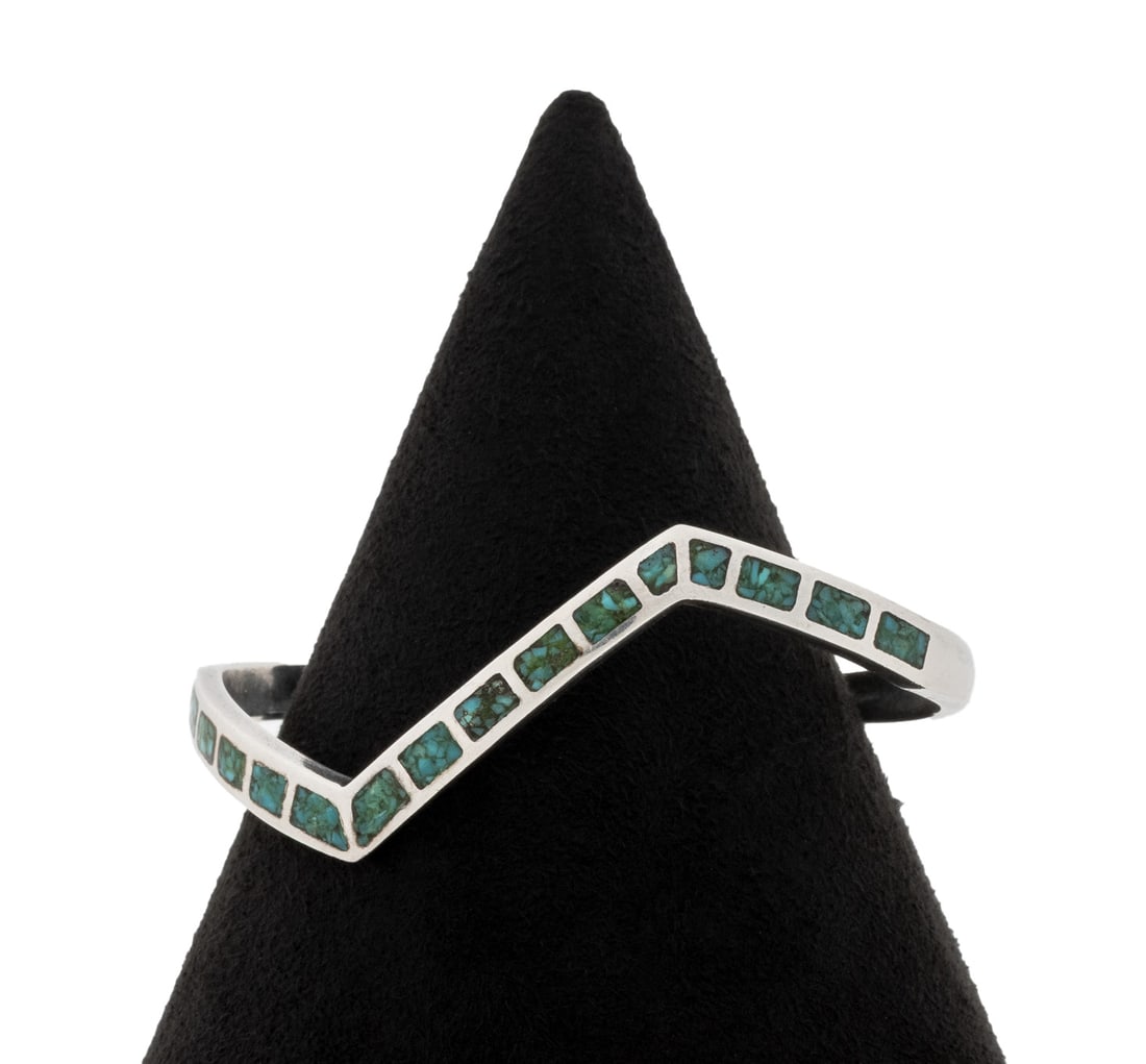 Sterling Silver Turquoise Inlay Cuff Bracelet: Sterling Silver Turquoise Inlay Cuff Bracelet, designed as a zig zag cuff bracelet decorated with chip turquoise inlays, worn on wrist without clasp. Silver tested. Measuring approx. 7" x 3/16", 1/4" 