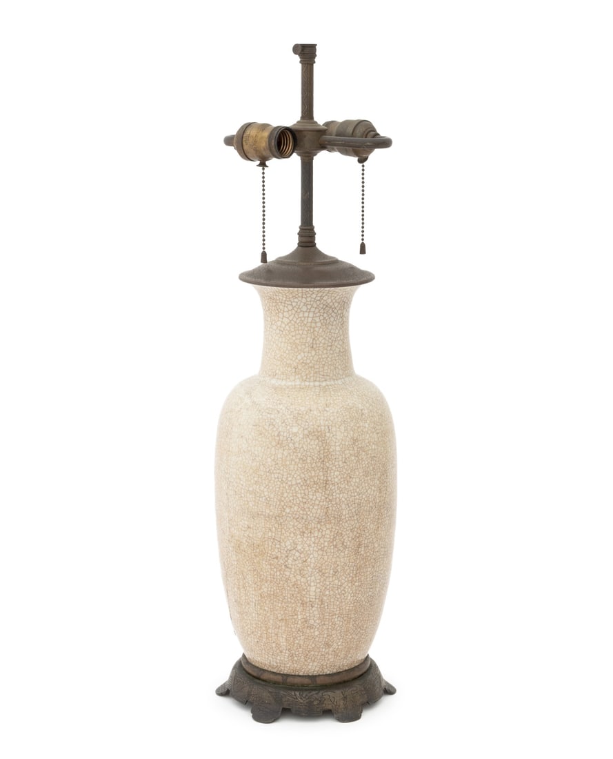 Chinese Ge Type Porcelain Vase Mounted as a Lamp: Chinese Ge Ware Type Porcelain Vase Mounted as a Table Lamp, the crackle glazed vessel mounted on a chased brass base and surmounted by two bulb fittings. 26.75" H x 6.75" Diameter. Provenance: From a