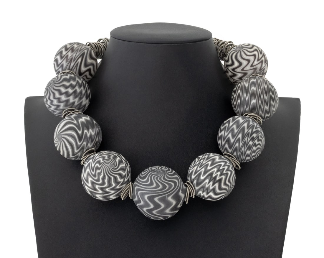 Bridgland Studios Art Glass Beaded Necklace: Bridgland Studios Art Glass Beaded Necklace, with black and gray glass beads and sterling silver clasp closure marked "925". 19" L x 1.5" W. Provenance: From the Collection of Laura and Lewis Kruger. 