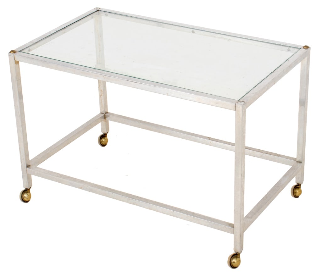 Postmodern Glass and Chrome Bar Cart: Postmodern Glass and Chrome Bar Cart, with brass accents to corners, on four casters. 18.5" H x 27.5" W x 16.5" D. Provenance: From a New York City Collection. Keywords: Modern Furniture, Rolling cart