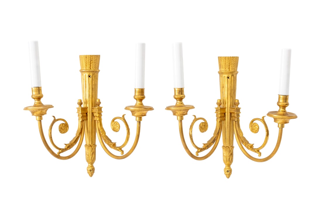 French Empire Style Ormolu Wall Sconces, Pair: Pair of French Empire Style Ormolu Wall Sconces, with two branches and foliate scroll design. 12.75" H x 11" W x 6.5" D. Provenance: From the Fifth Avenue Estate of a Distinguished Author and Humanita