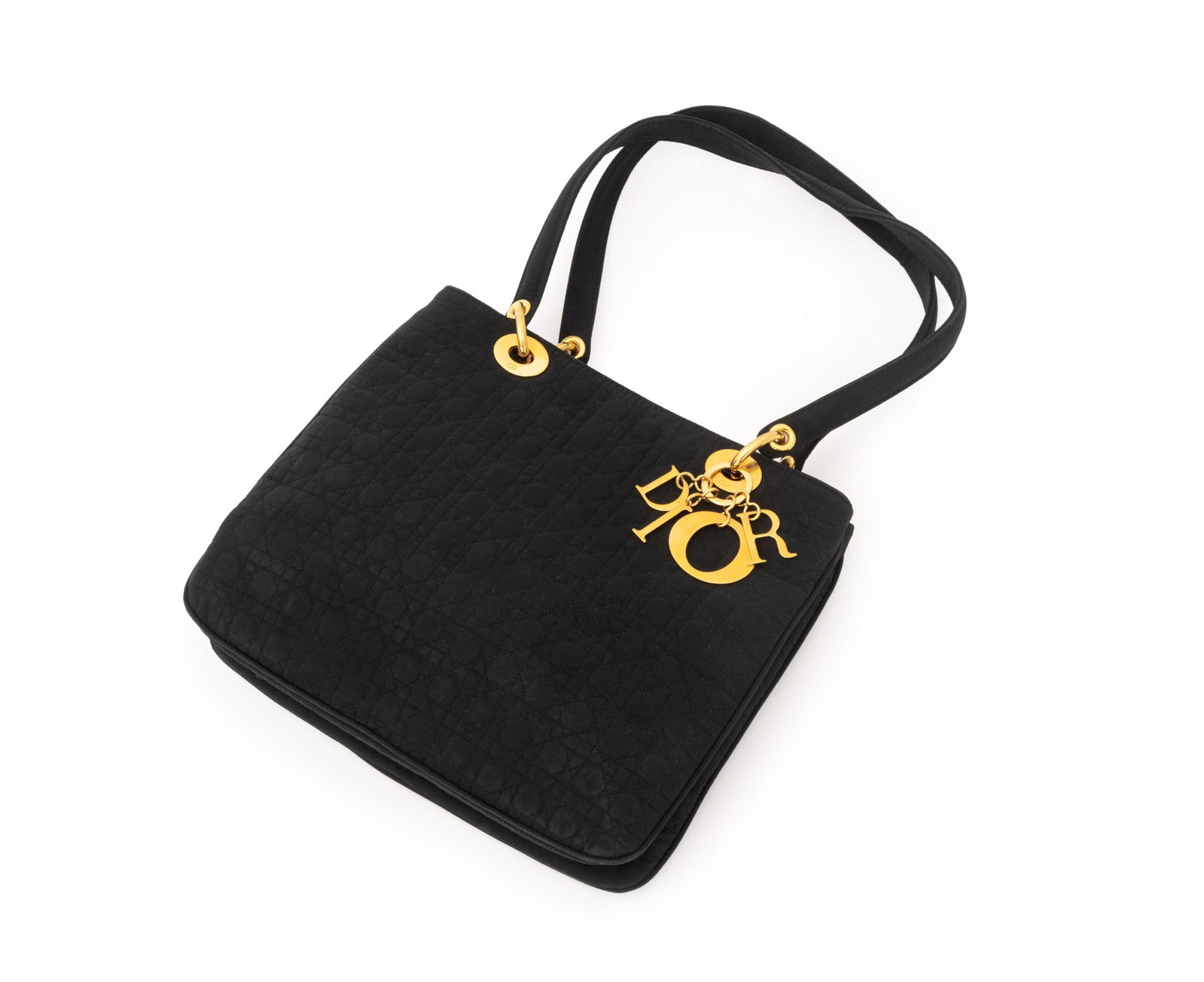 Christian Dior "Lady Dior" Cannage Black Tote Bag: Christian Dior "Lady Dior" Cannage Black Quilted Nylon Tote Bag, with gold-tone hardware and "Dior" charm, double top handles, red lined divided interior with central zipper pocket, marked "Christian 