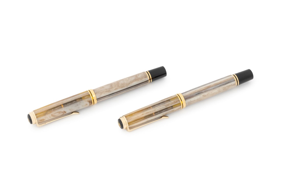 Pelikan "Piazza Navona" Pens, 2: Pelikan "Piazza Navona" Fountain Pen and Rollerball Pen, with translucent marbled cream, tan, and gray cases and gold-tone hardware, each marked "Germany / Pelikan / Souveran" to case, gold nib marked
