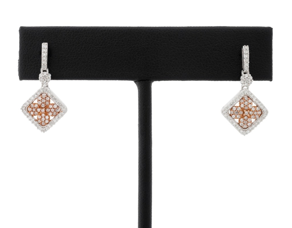 Two-Tone Gold Diamond Dangle Earrings: Pair of Two-Tone 10K Gold and Diamond Dangle Earrings, featuring 148 prong set single cut diamonds weighing a total of approx. 0.80 carat, worn through pierced earlobes with posts and friction backs, 