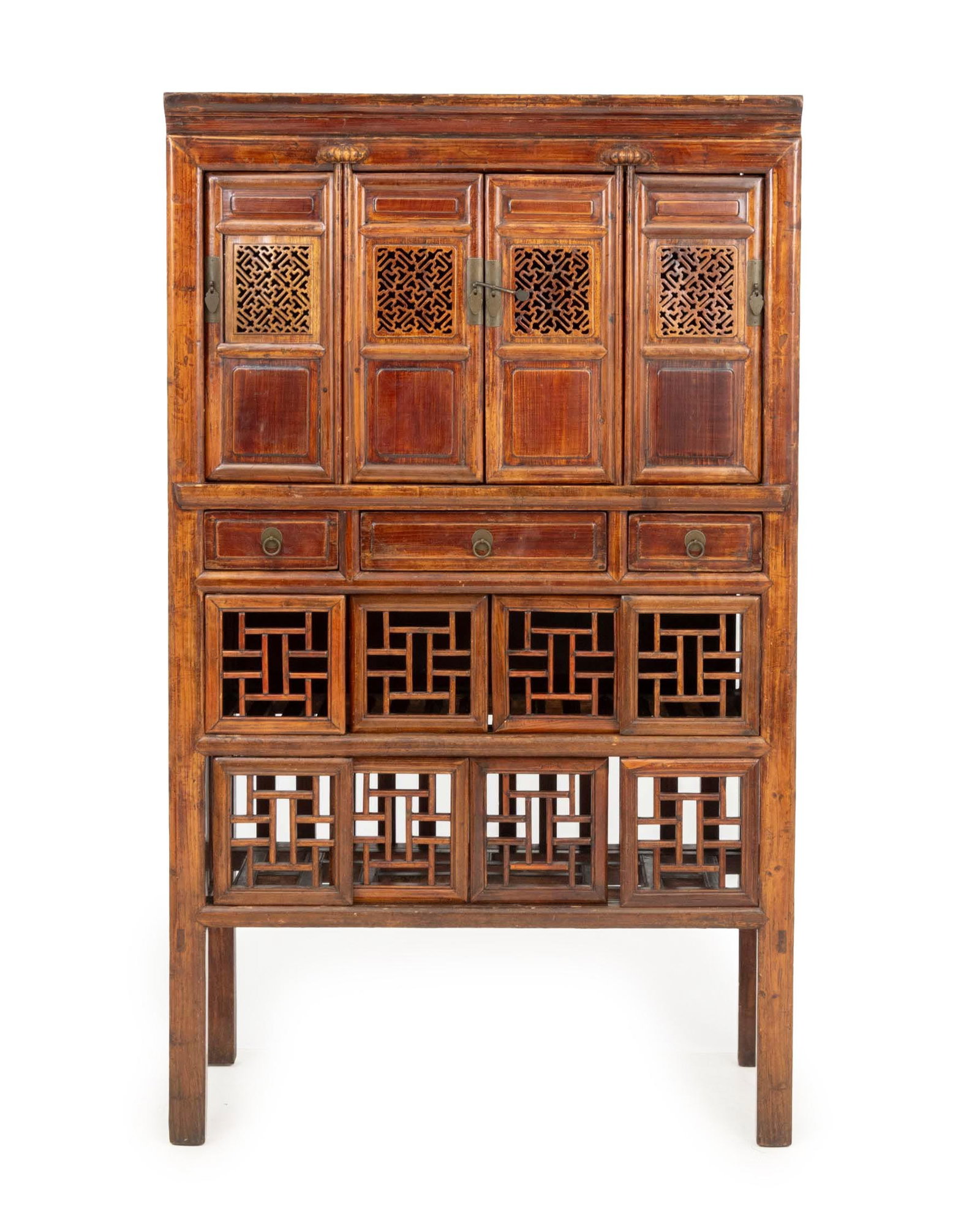 Chinese Carved Elm Wood Cabinet: Chinese Carved Elm Wood Cabinet, early 20th century, the upper level with with pierced doors, above three central drawers, and surmounting two levels of drawers with sliding fretwork doors. 69.5" H x 