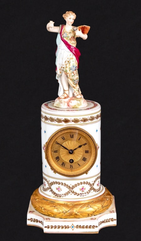 Louis XVI Style Sevres White Ground Figural Clock: Louis XVI Style Sevres White Ground Porcelain Figural Pedestal Clock, late 19th century, the brass circular dial, timepiece movement, on acanthus wreath base and square plinth, marked with crossed swo