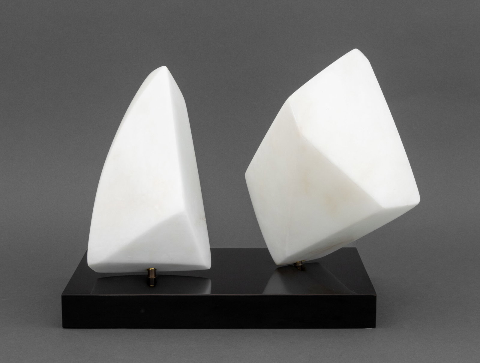 Modernist Abstract White Marble Sculpture, 1986: Modernist Abstract White Marble Sculpture, 1986, comprised of two carved white marble pieces mounted on a black stone base, signed and dated "FCR 86" to reverse of larger stone. 13" H x 14" W x 9" D. 