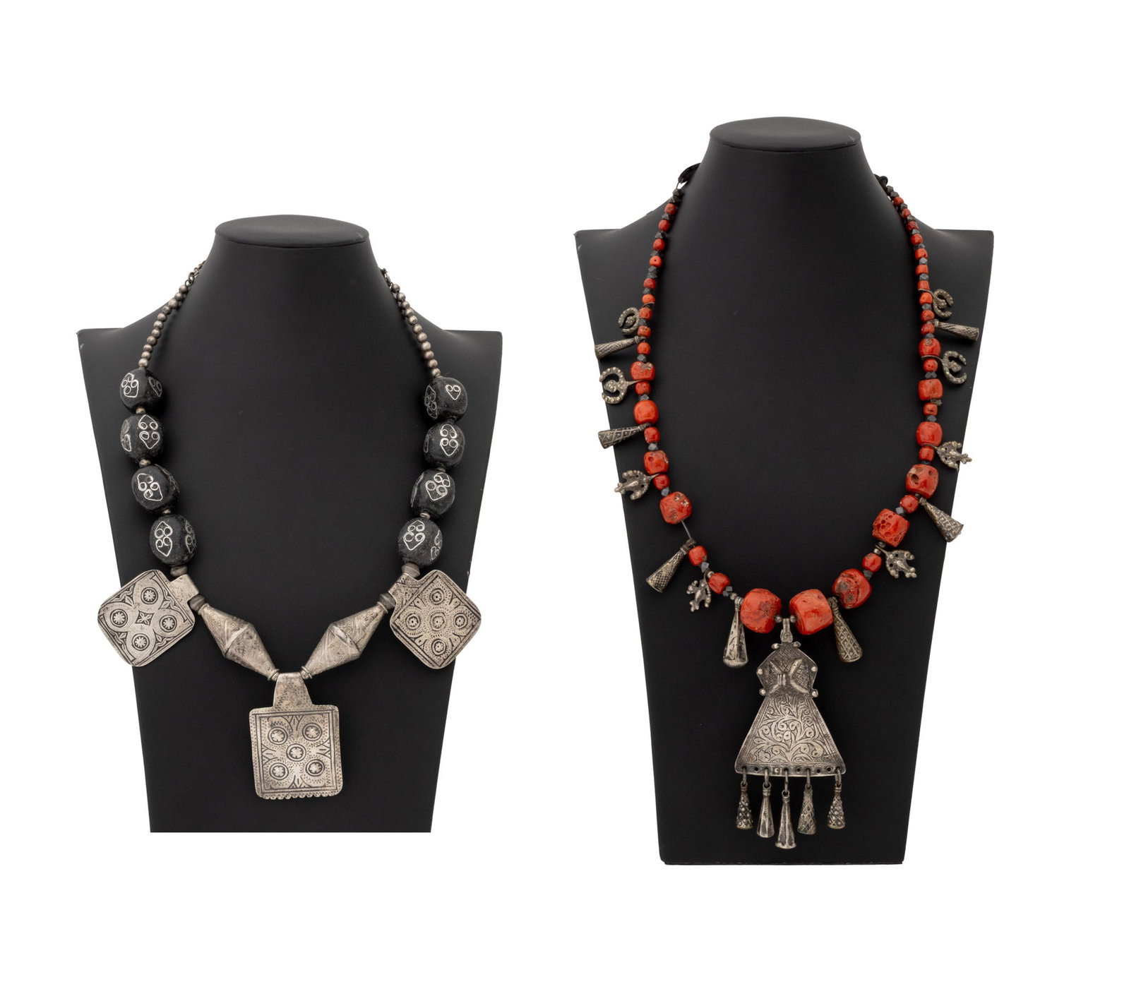 African Berber Silver Beaded Necklaces, 2: Two African Berber Silver Beaded Necklaces, one with red coral beads and one with silver inlaid black beads. Coral: 30" L x 5" W. Provenance: From the Estate of Jewelry Designer Irena Corwin. Keywords