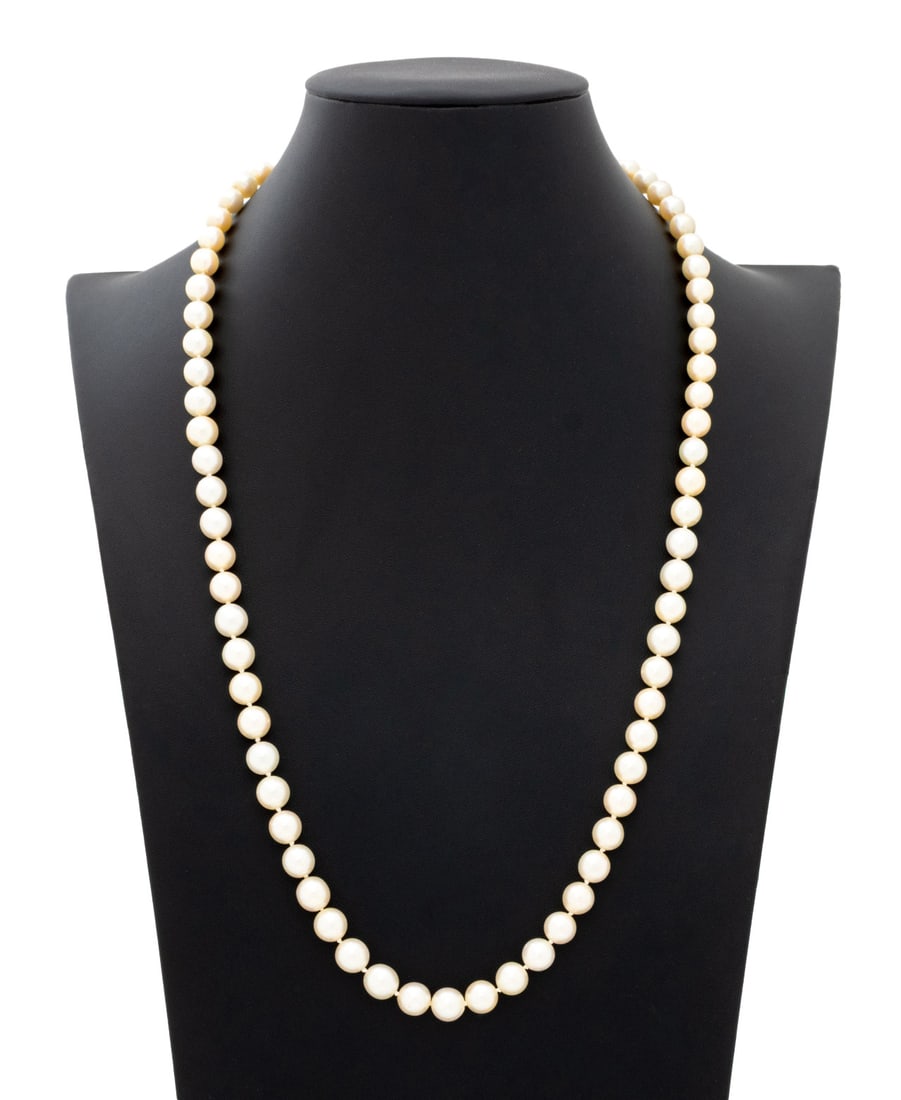 18K Yellow Gold Cultured Pearl Necklace: 18K Yellow Gold Cultured Pearl Necklace, featuring 74 fully drilled round cultured Akoya pearls approx. 7.5 - 9.0 mm., strung on silk cord and knotted between each pearl, joined with 18K yellow gold f