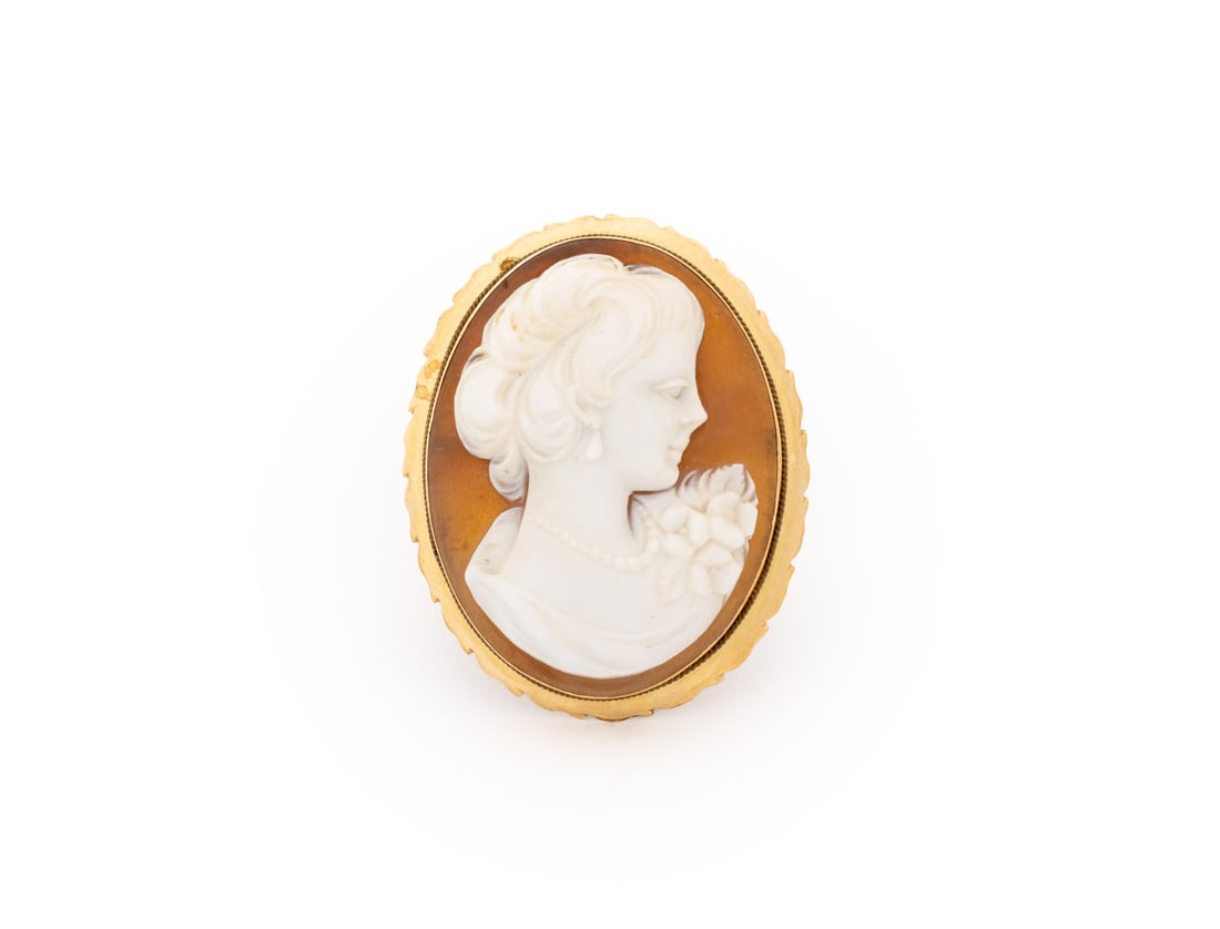Carved Cameo Silhouette Yellow Gold Brooch Pendant: Carved Cameo Silhouette 18K Yellow Gold Brooch Pendant, featuring one centered bezel set carved shell cameo approx. 33 x 27 mm., worn through fabric with pinstem, joint and catch, may also be worn as 