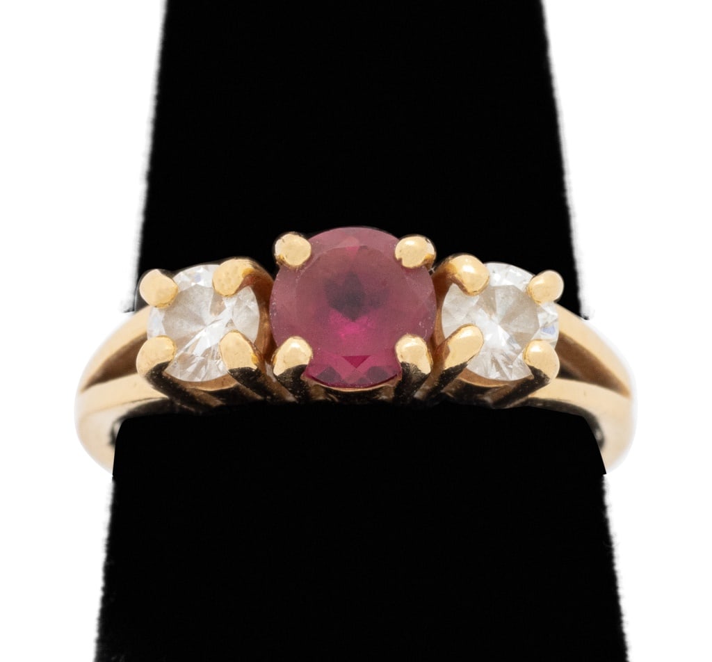 Pink Tourmaline and Diamond Yellow Gold Ring: 14K Yellow Gold Pink Tourmaline and Diamond Three-Stone Ring, adorned with one pink tourmaline cabochon weighing approx. 0.50 carat and two Diamonds weighing approx. 0.50 carat, marked: "T 14K". Measu