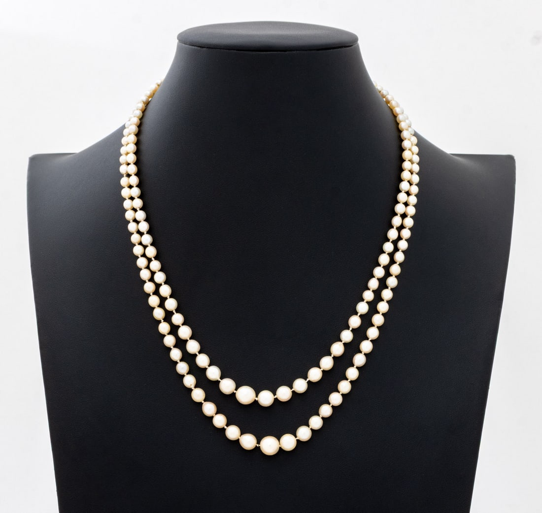 Diamond and Sapphire Cultured Pearl Necklace: Diamond and Sapphire 14K Gold Clasp Cultured Pearl Necklace, featuring 167 fully drilled cultured Akoya pearls approx. 3.4 - 7.8 mm., two strands strung on silk cords and knotted between each pearl,