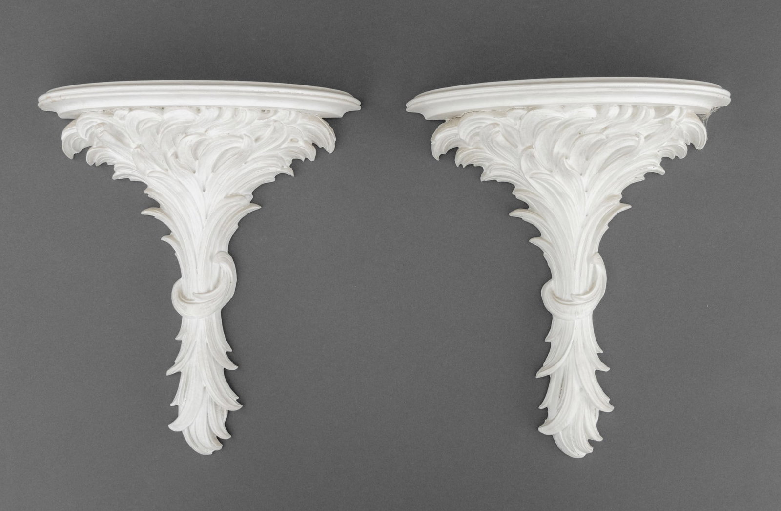 Neoclassical Style Foliate Form Wall Brackets, Pr.: Pair of Neoclassical Style White Painted Foliate Form Wall Brackets. Each: 12.75" H x 11.25" W x 5.25" D. Provenance: From a Connecticut Estate. Keywords: Corbels, Wall shelf, Display shelves, Shelvin