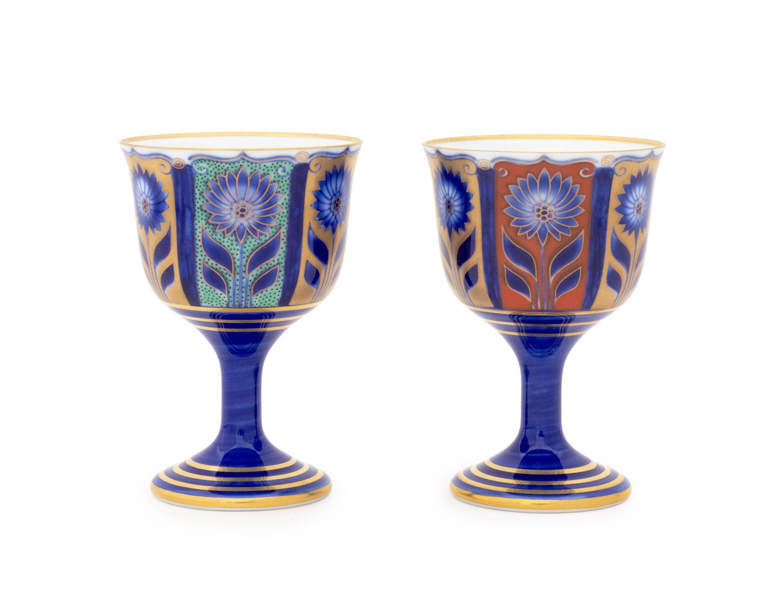 Japanese Fukagawa Porcelain Wine Cups, Pair: Pair of Japanese Fukagawa Porcelain Wine Cups, with blue lotus flower and gilt trim design, marked to undersides. 4" H x 2.75" Diameter. Provenance: From the Fifth Avenue Estate of a Distinguished Aut