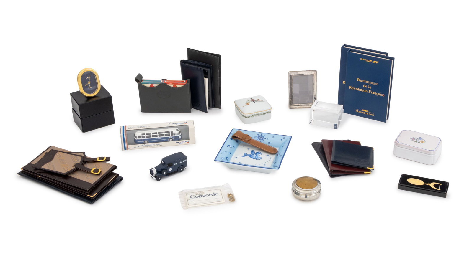 Concorde and Air France Collectibles, 26: Collection of 26 Concorde and Air France Collectibles, including: Elizabeth II sterling silver photo frame, struck with marks for British Airways, Sheffield, 1990, engraved "Concorde", seven leather c